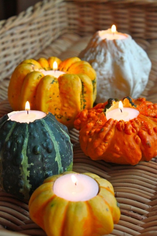 gourds and pumpkins with tealights on top are easy candleholders with a strong fall spirit