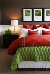 a bright jewel-toned bedroom with bold red and green and some very dark brown for a bold look