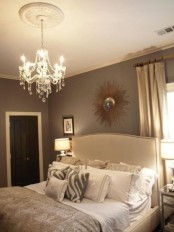 a refined neutral bedroom done in greys, beige and creamy shades plus crystal and metallics for a welcoming fall look