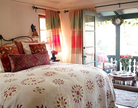 a bright fall bedroom with touches of green, red, burgundy and neutrals and much pattern for a countryside feel