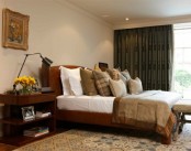 a fall bedroom done in neutrals, rust, greens and brown shades plus some touches of vintage elegance in decor