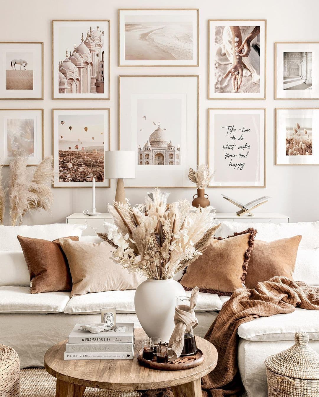 rust-colored pillows and a fall leaf arrangement make this outdoor living room cooler