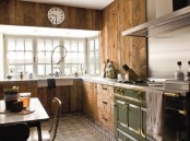 a chalet kitchen clad with reclaimed wood, with a tile floor, a green cooker, touches of metal here and there