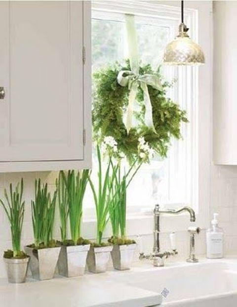 an evergreen wreath witha green bow and some bulbs will give a slight Christmas feel to the space