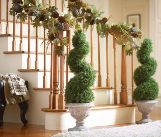 Several topiaries would look great by your staircase and in winter you'd be able to hang some Christmas ornaments to them.