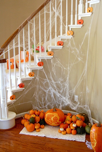 If you don't like idea to put real pumpkins on your steps you could cut some funny pumpkin-shaped faces and use them instead.