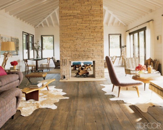 Cozy Living Room With A Stacked Stone Fireplace