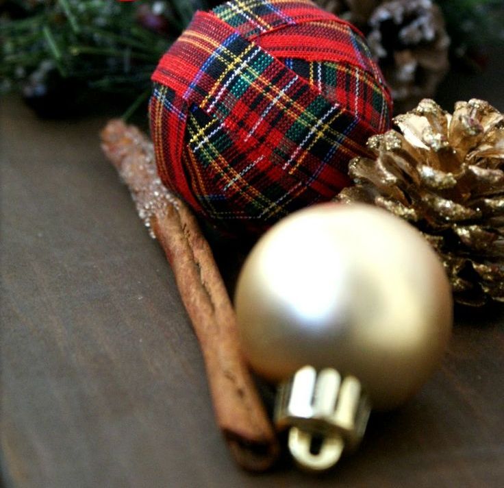 wrap a usual Christmas ornament with red plaid ribbon to make it look bright and festive and to accent your Christmas tree and not only