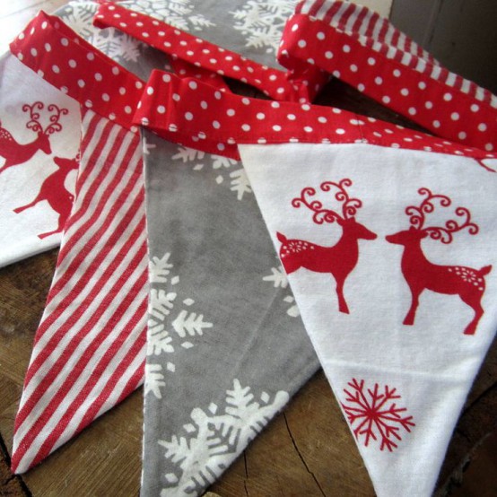 a red, grey and white Christmas garland with prints is a very cool and bold idea to decorate any space and you can DIY such a piece