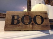 a simple rustic sign with BOO letters is an easy Halloween decoration to rock
