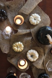 burlap, candles, white and black pumpkins for decorating your home for Halloween in rustic style