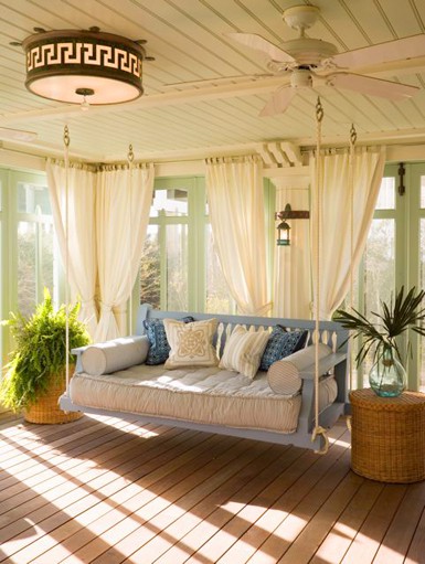 Cozy Sunroom With A Hanging Sofa