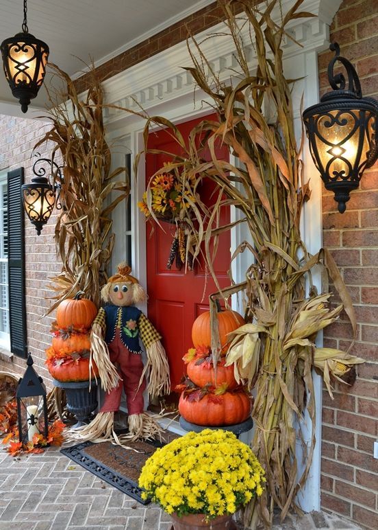 Dried cornstalk, pumpkin's topiaries, mums and a cute scarecrow would frame your door with style.