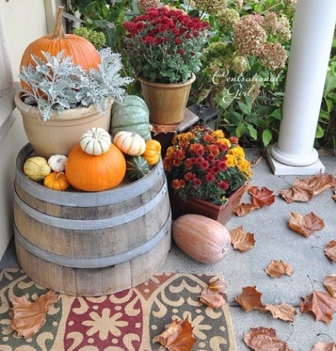 Cozy Thanksgiving Porch Decor Ideas If you think old wooden barrels are cool but too big for your porch decor you can cut one in half. It'd make a perfect stand for your arrangement.