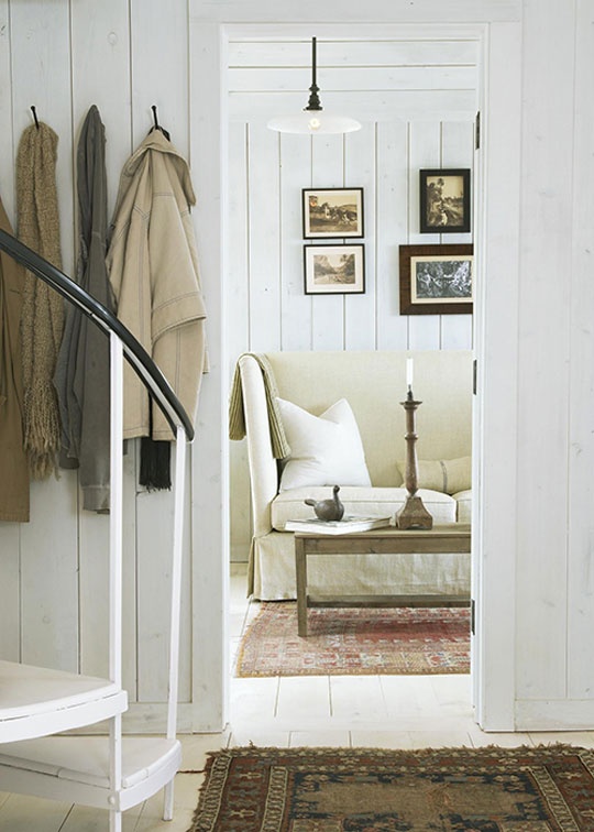 a wood clad space fulled whitewashed looks rustic chic but not too rustic at the same time thanks to whitewashing