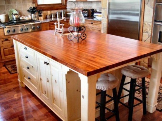 rich stained wooden countertops in a neutral kitchen are a great means to warm up the space and make it catchy