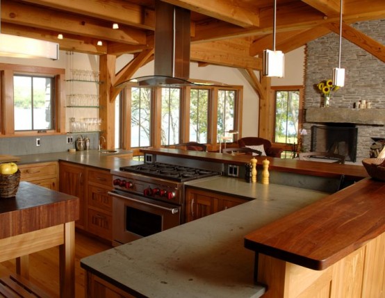 a chalet kitchen done with light and rich stained wood and stone is a stylish space, with ultimate coziness and warmth