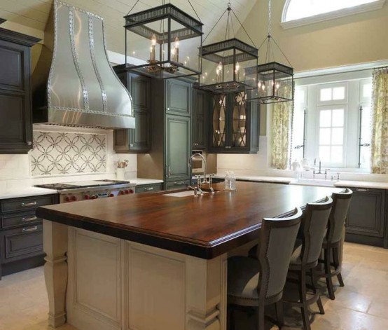 a vintage graphite grey kitchen and a neutral kitchen island with dark stained countertops that add elegance and chic
