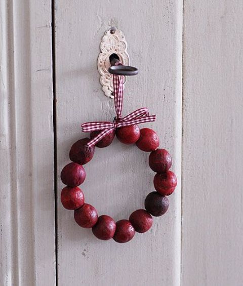 a small and cute cranberry Christmas wreath will be a nice door decoration that you can fast and easily make