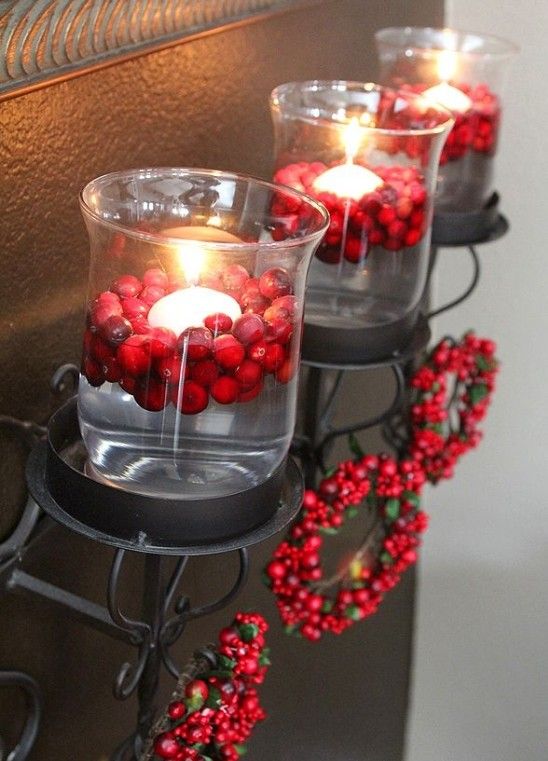 glass candleholders with cranberries and floating candles and cranberry wreaths are amazing Christmas decorations to rock