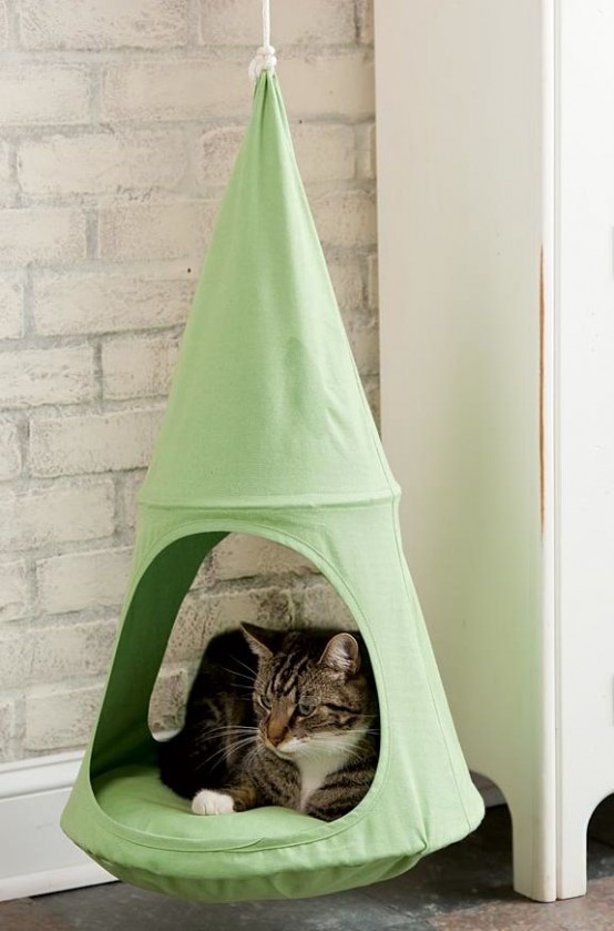 a suspended green cat bed is a comfy idea for your kitty, it will be able to lie in a raised bed and even move a bit