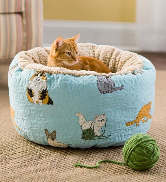 a colorful ottoman-style cat bed of fun printed fabric is always a nice and veyr comfy idea, your cat will soak in it