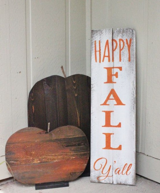 a simple and rustic fall sign and a couple of pumpkins made of plywood for fall decor