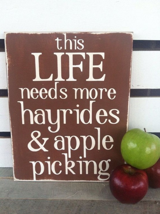 a simple brown and white sign with some apples around is a cool idea for fall decor