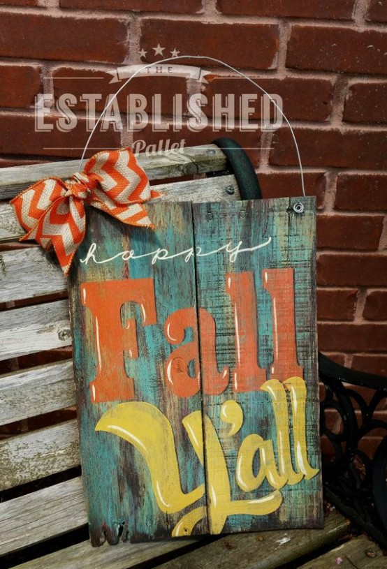 a patina fall sign with colorful letters and a bright ribbon bow to accent it
