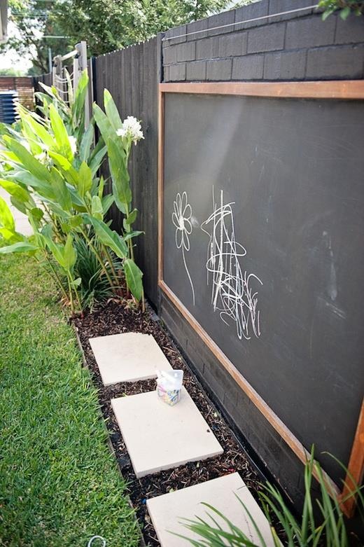 a large chalkboard and colorful chalk will inspire your kids' creativity outdoors, too