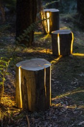 ultra-modern outdoor lights made of old tree stumps look fantastic: this is a natural and modern interpretation of an outdoor lamp plus reusing unnecessary pieces