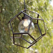 an outdoor pendant lamp with a faceted lampshade with no glass at all is a cool idea for a modern outdoor space