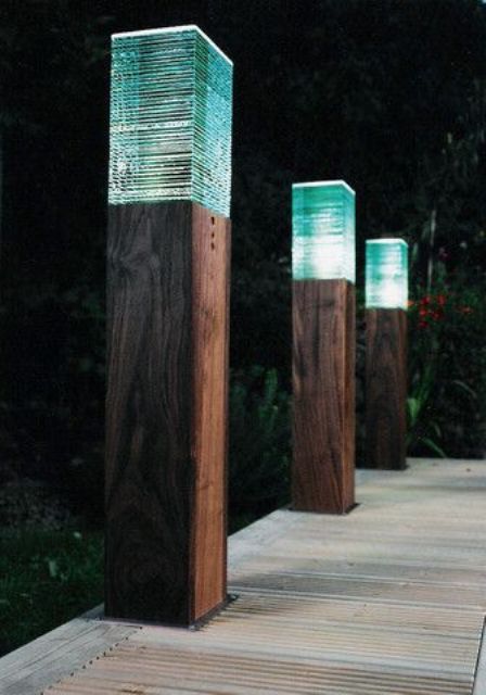stylish modern pole lights with blue glass lampshades are amazing for a cool modern outdoor space