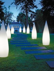 bold modern drop-shaped outdoor lights and lamps are great to line up the walkway like here and can be placed around your terrace, too