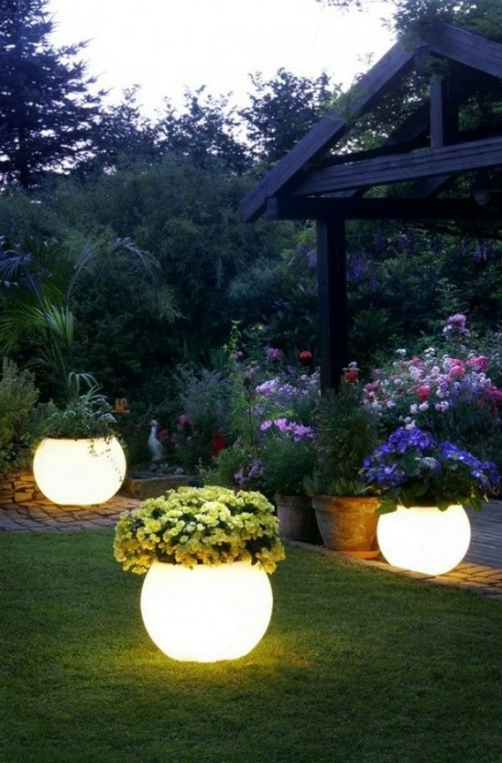 illuminated planters with bold blooms are double-function pieces that won't make you waste your space on additional lantersn and lamps