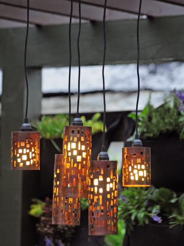 catchy pendant lamps with whimsical metal cutout lampshades will give subtle and intimate light to your outdoor space