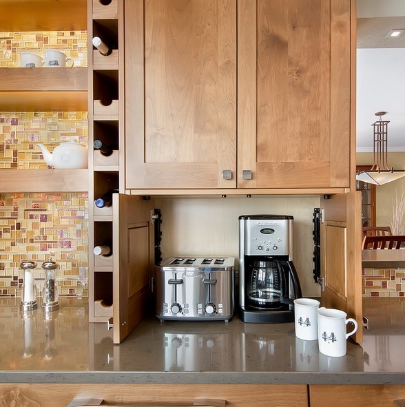 a mini cabinet with a coffee machine and a toaster under an upper cabinet will keep your small kitchen neat and decluttered