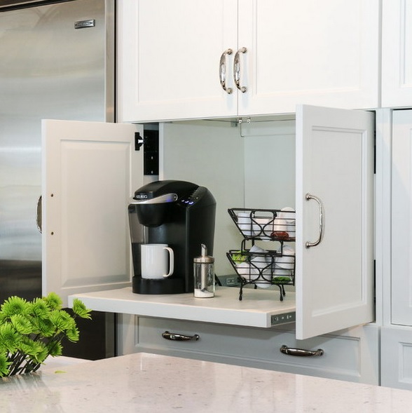 a small cabinet with a retracting shelf hides a whole coffee station, which is very comfy and cool