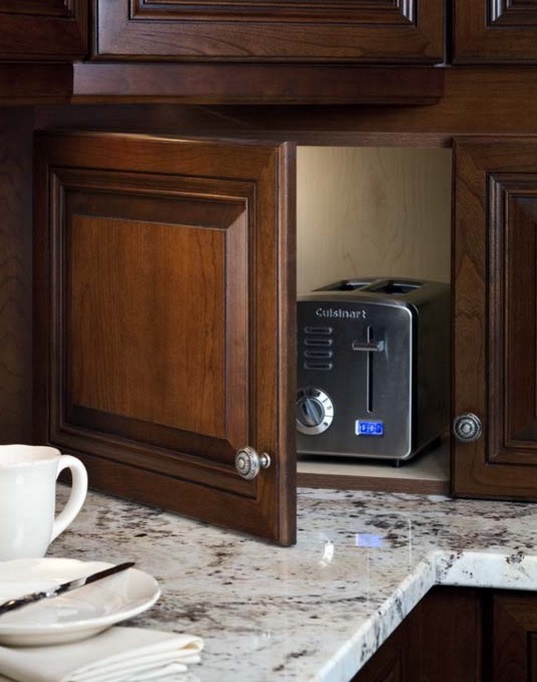 a dark stained cabinet with a toaster is a lovely idea if you use it only for breakfast and don't need in any other time