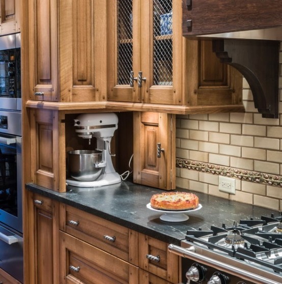 part of countertop turned into a cabinet with a floding door and hiding a mixer is a lovely and cool idea to keep the space decluttered