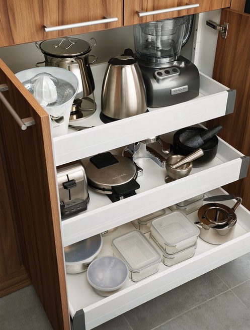 a cabinet with retractable shelves to hold appliances, pots and other stuff is a cool idea to rock