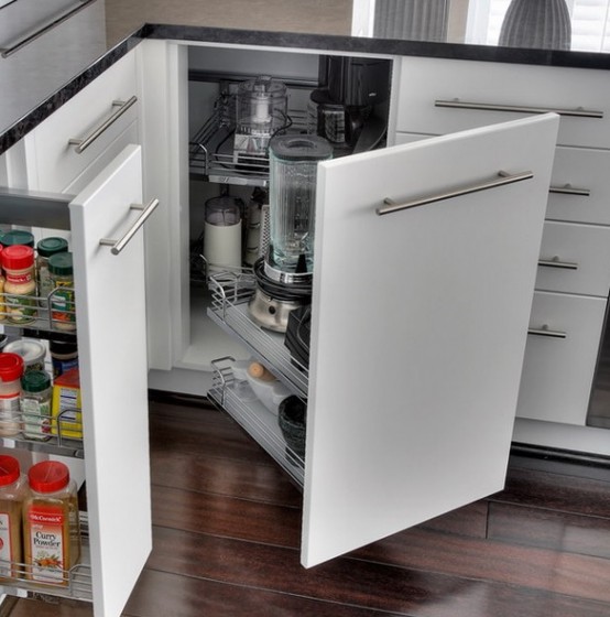a corner cabinet with usual and retractable shelves, jars, appliances and other stuff