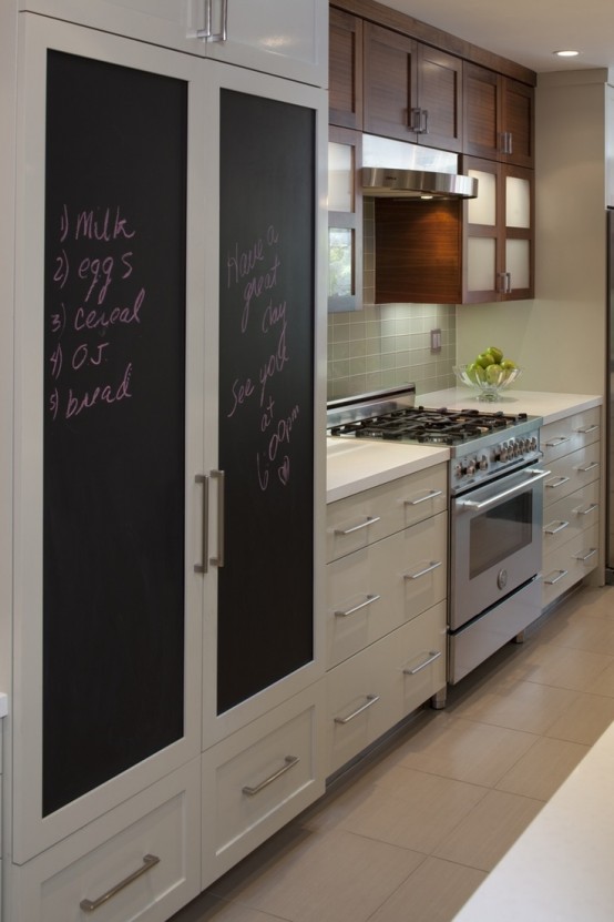 a neutral kitchen with a large storage piece with chalkboard doors that cozies up and relaxes the decor of the space