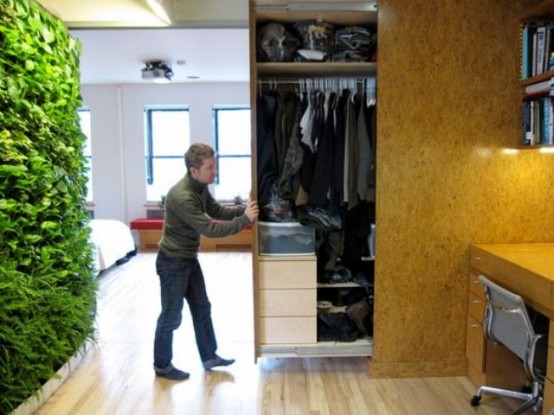 a whole closet hidden in the wall and retracted when needed is a cool idea for small homes - you won't need a separate room