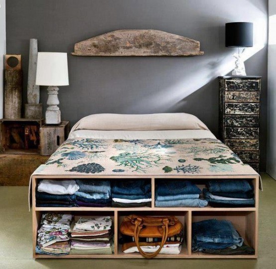 an open storage cabinet that doubles as a bench at the foot of the bed is a smart and easy idea to store some clothes