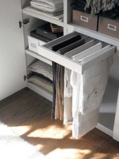 a small shelf for hanging pants – it features several holders that can accommodate several pants