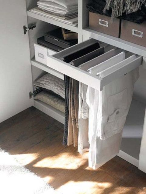 a small shelf for hanging pants - it features several holders that can accommodate several pants