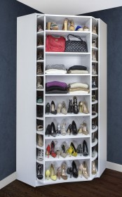 a corner shoe cabinet with shoes and bag shelves that are rotating to give you evne more storage space
