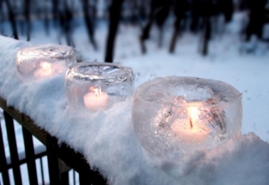 glass-shaped ice candleholders are easy to make yourself and they can placed anywhere you like to add a amgical touch to the space