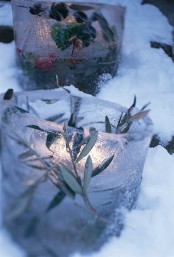 ice luminaries with grass, greenery and berries are amazing for winter and Christmas outdoor decor
